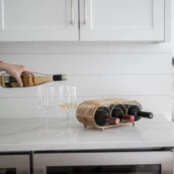 Wrapped Brass Metal & Rattan Wine Bottle Holder - Foreside Home & Garden -Eco Haven Store GUEST 61894069 e598 47da 9674 32a24ffe54e9